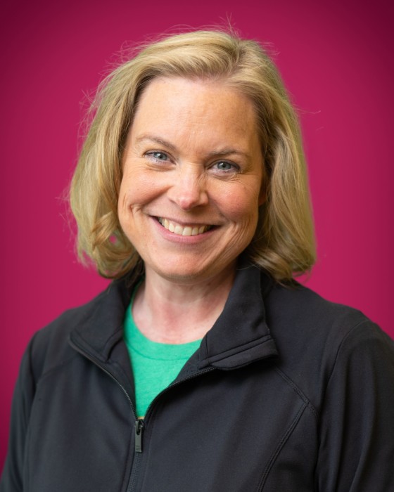 Portrait of Sarah Schluter smiling.