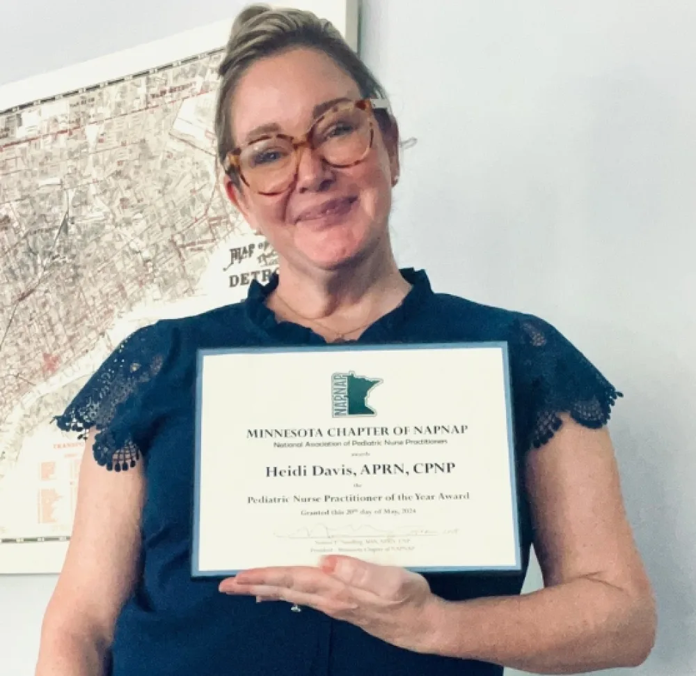 Heidi Davis, APRN, CPNP, holds National Association of Pediatric Nurse Practitioners (NAPNAP) award. - Gillette Children's