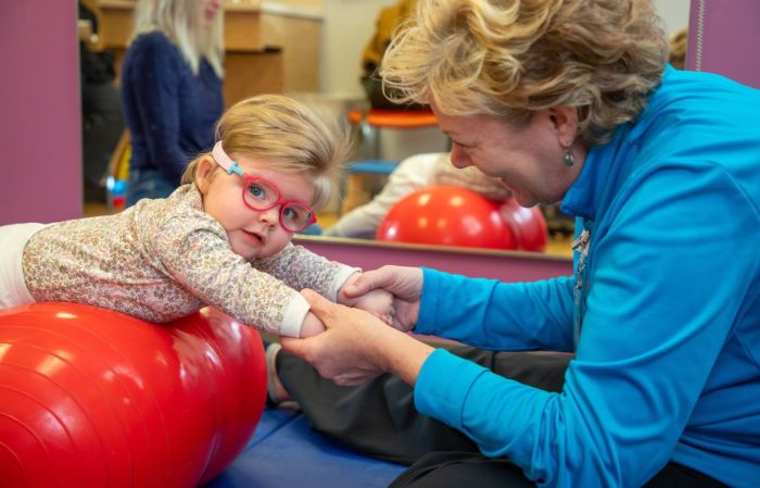 Gillette Children's provider works with patient.
