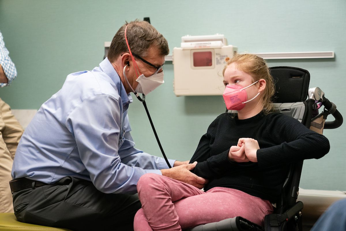 Dr. Beisang examines a patient in the Gillette Children's Rett Clinic