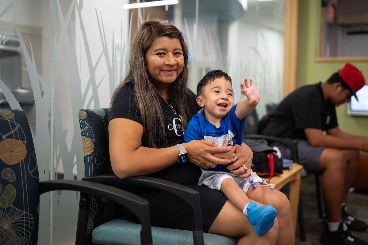 Ernesto and his mother, Dalia, wait for their appointments in the lobby of the Gillette Children's Burnsville Clinic.