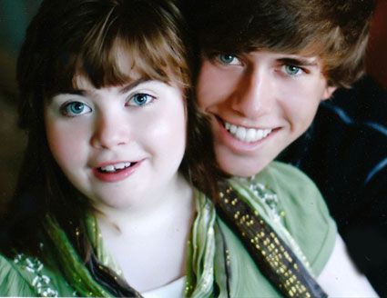 Megan, who has Rett syndrome, is pictured with her brother. 