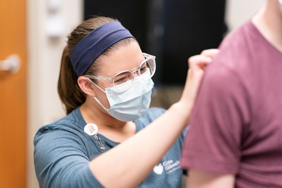 Danielle Harding examines a Gillette spine patient.
