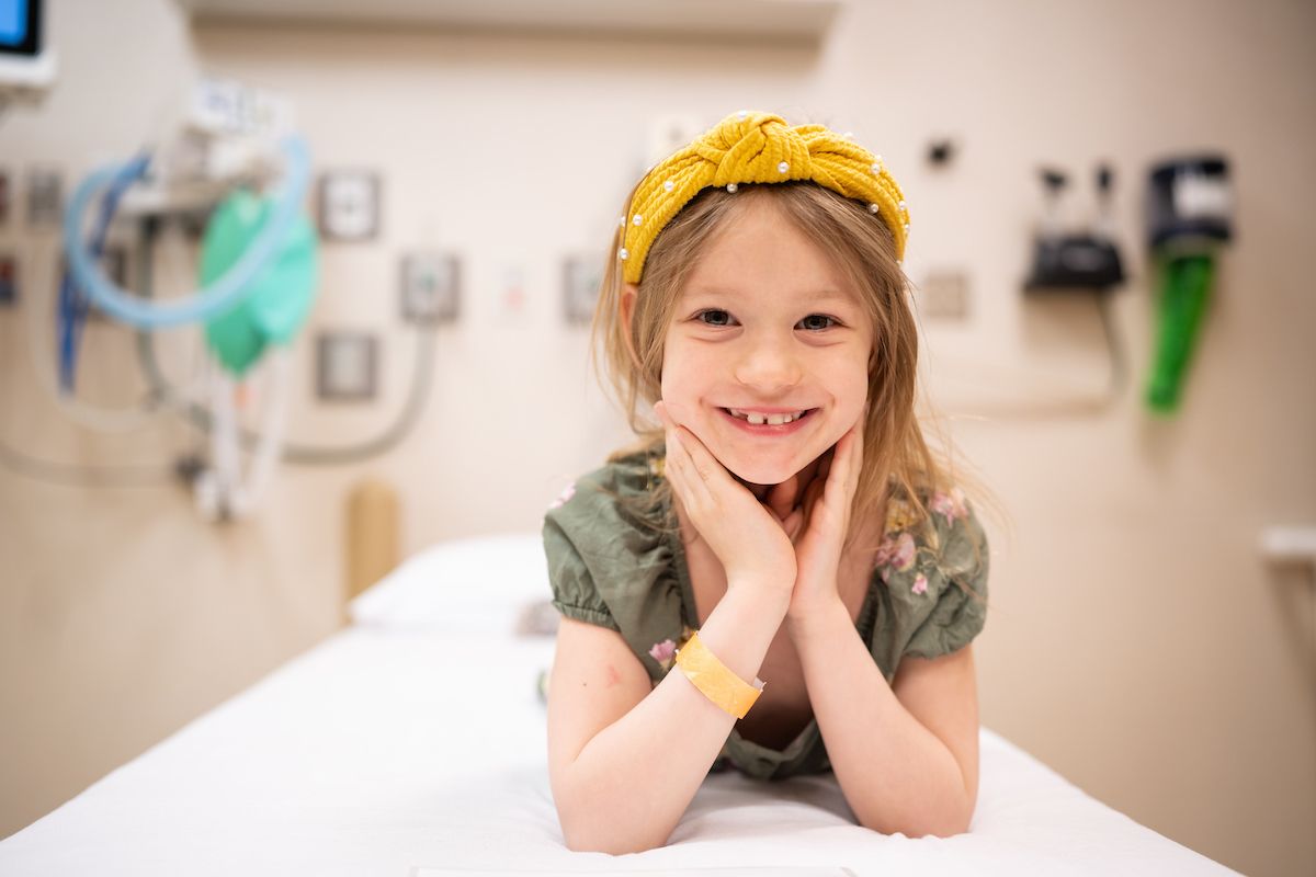 Emma smiles in the Gillette Children's clinic room.