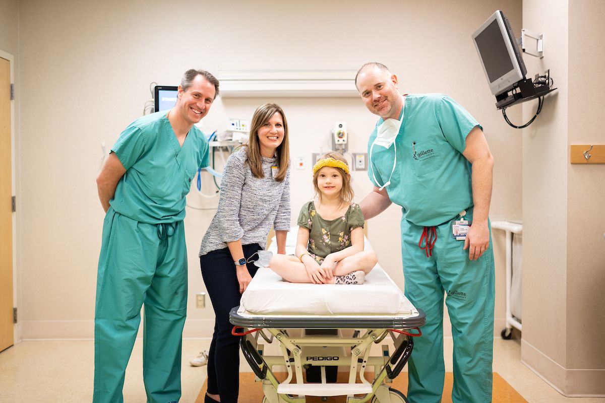 Gillette Children's orthopedic surgeons, Marc Tomkins, MD (left) and Trent Cooper, MD (right) with ACL patient Emma Durward.